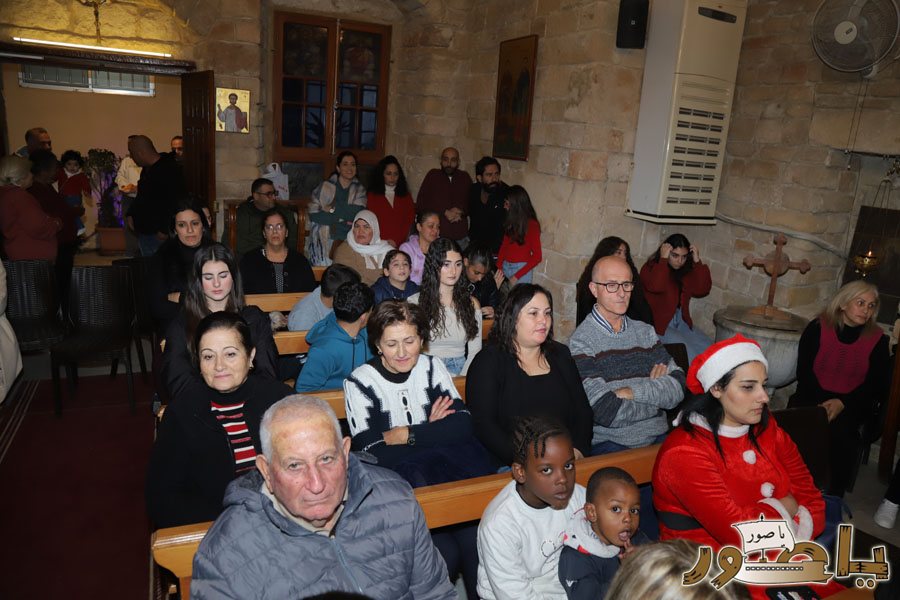 رسيتال ميلادي حاشد في كنيسة مار توما للروم الأرثوذكس صور